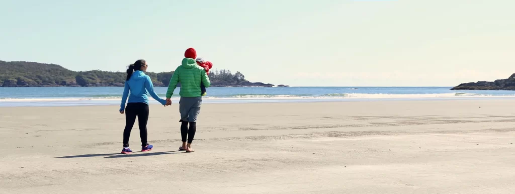 Family enjoying beach day in Tofino, BC, practicing mindfulness